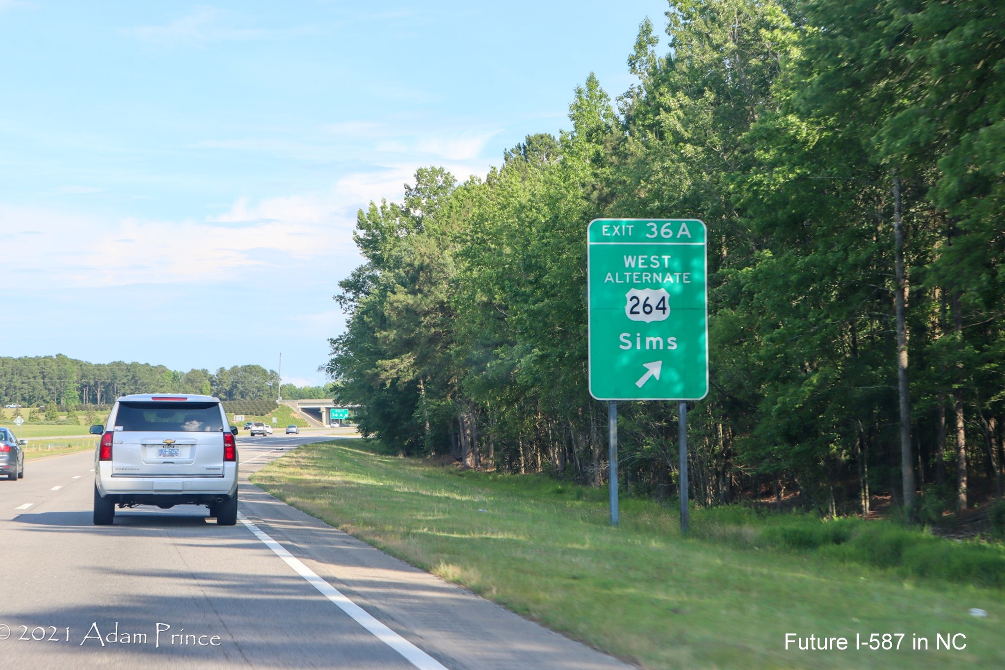 Ground mounted ramp sign for West US 264 Alternate exit on US 264 East (Future I-587 South) in Sims, photo by Adam Prince, June 2021