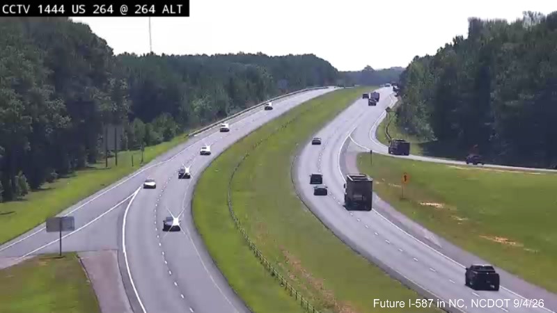 NCDOT traffic camera image of work underway on pavement rehabilitation project east of
	the US 264 Alt exit on US 264 East, September 2026