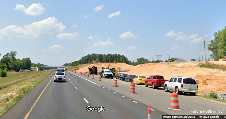 Image of still under construction exit ramp for Julian Airport Road on US 421 (Future I-685) North, 
        Google Maps Street View, July 2024