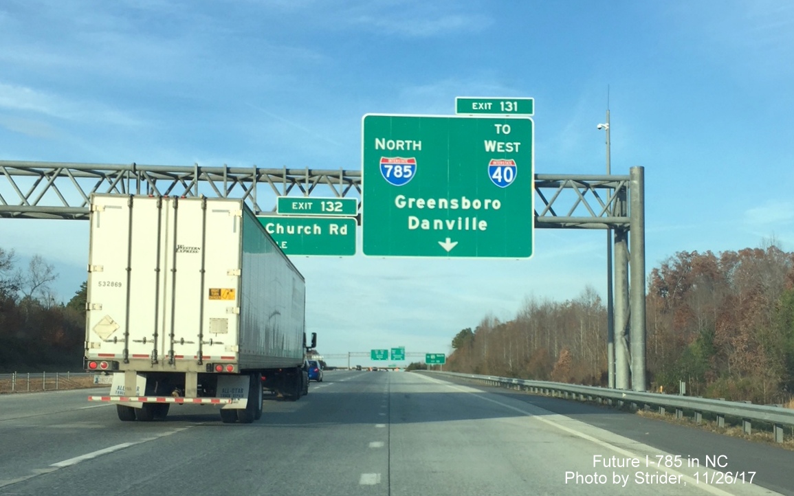 Image of overhead exit signage with I-785 shield along I-85 North/Greensboro Loop at I-40 interchange, by Strider