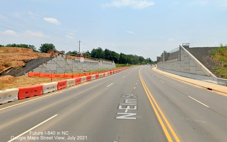 Image of bridge abutments being constructed for future I-840/Greensboro Loop bridge over North Elm Street, looking south, Google Maps Street View, July 2021