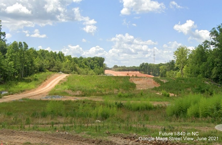 Image of view from Summit Avenue of cleared land for future I-840/Greensboro Loop awaiting grading after bridge is completed, Google Maps Street View, June 2021