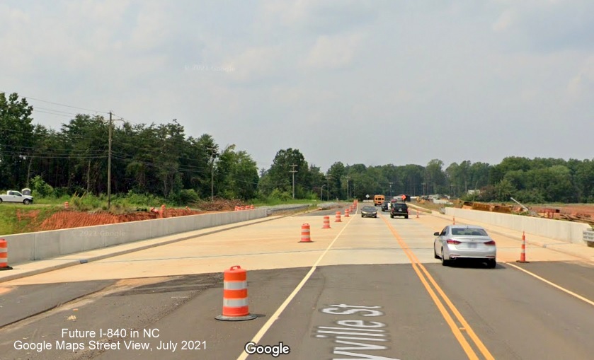 Image of view south along completed Yanceyville Street bridge over future I-840/Greensboro Urban Loop under construction, Google Maps Street View, July 2021