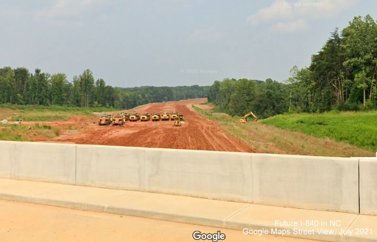 Image of view looking east from newly opened Yanceyville Street bridge over Future I-840/Greensboro Loop under construction, Google Maps Street View, July 2021