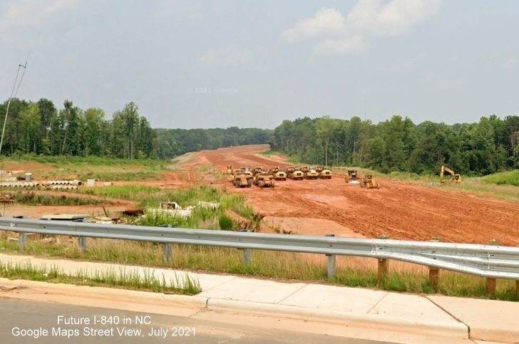 Image of view looking east from newly opened Yanceyville Street bridge over Future I-840/Greensboro Loop under construction, Google Maps Street View, July 2021