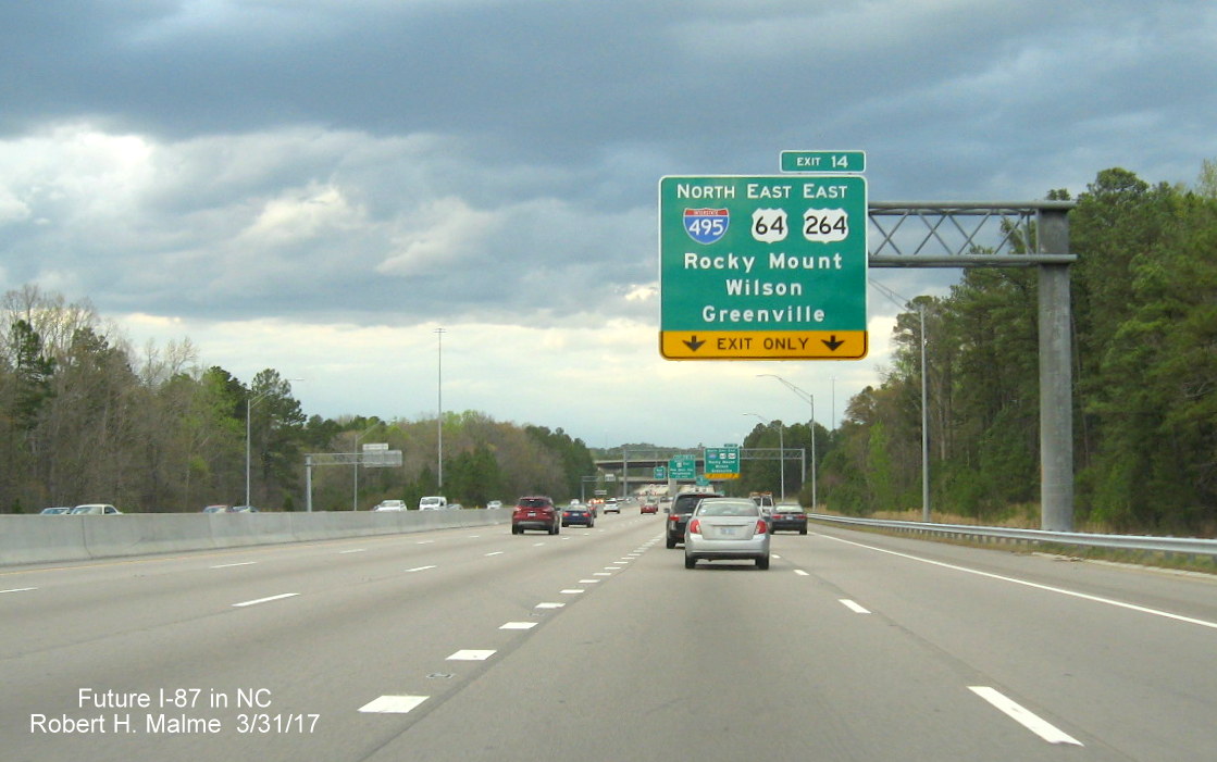 Image taken of Current I-495/US 64/US 64 exit signage on I-440 West in Raleigh