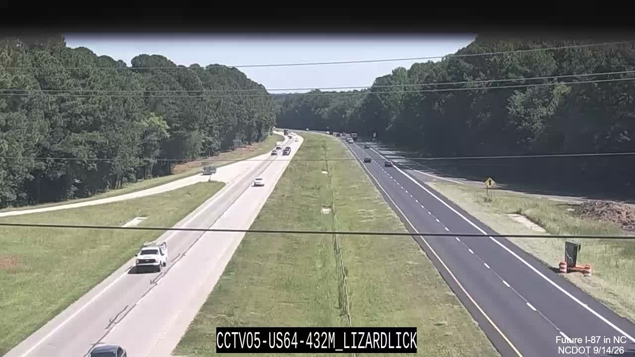 Image from NCDOT traffic camera of two lane paving as part of pavement 
		  rehabilitation project along East US 64/264 near mile marker 432, September 2026