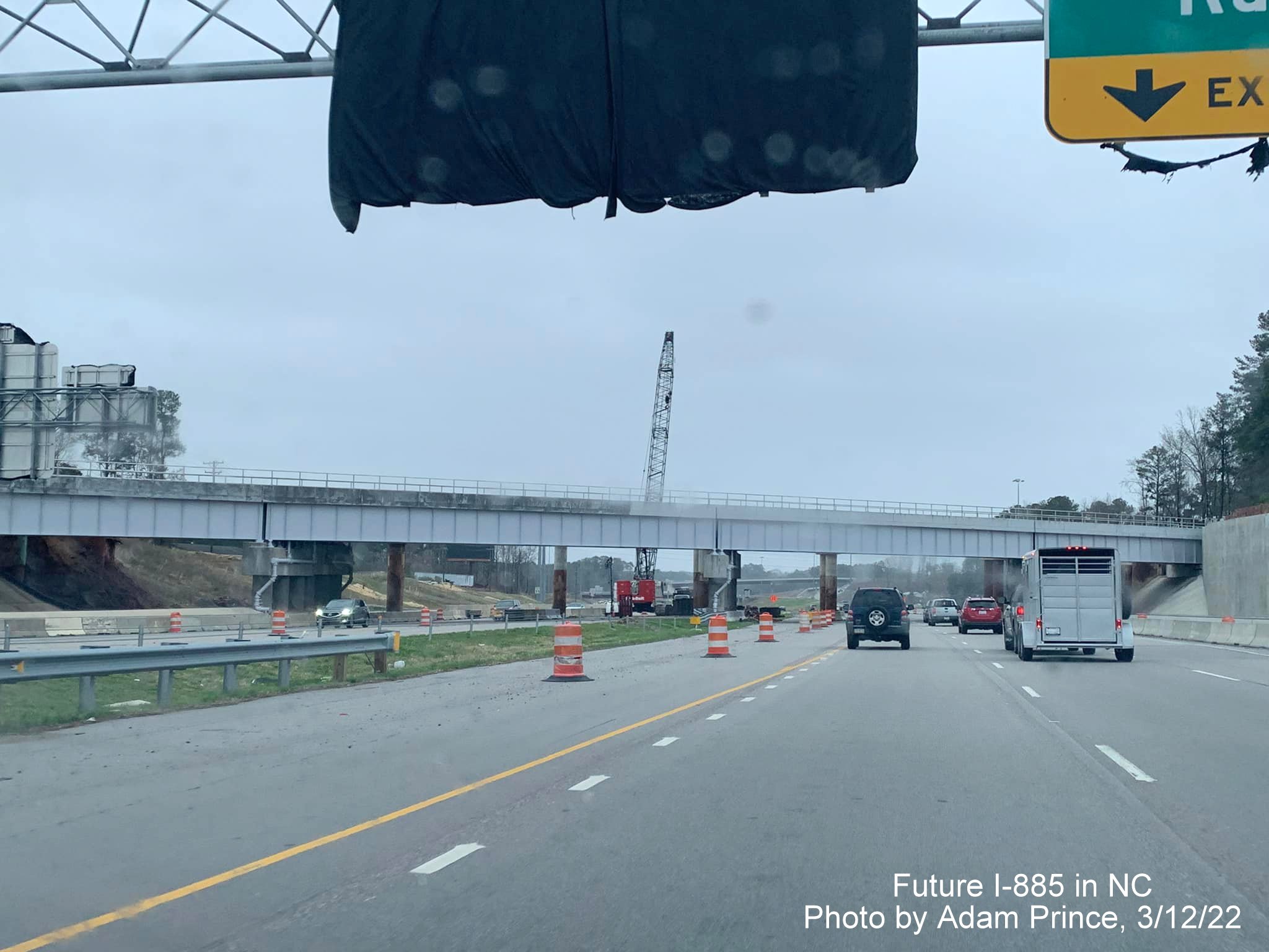 Image of railroad bridge demolition over US 70 (Future I-885) in Durham prior to East End Connector exit, by Adam Prince, March 2022