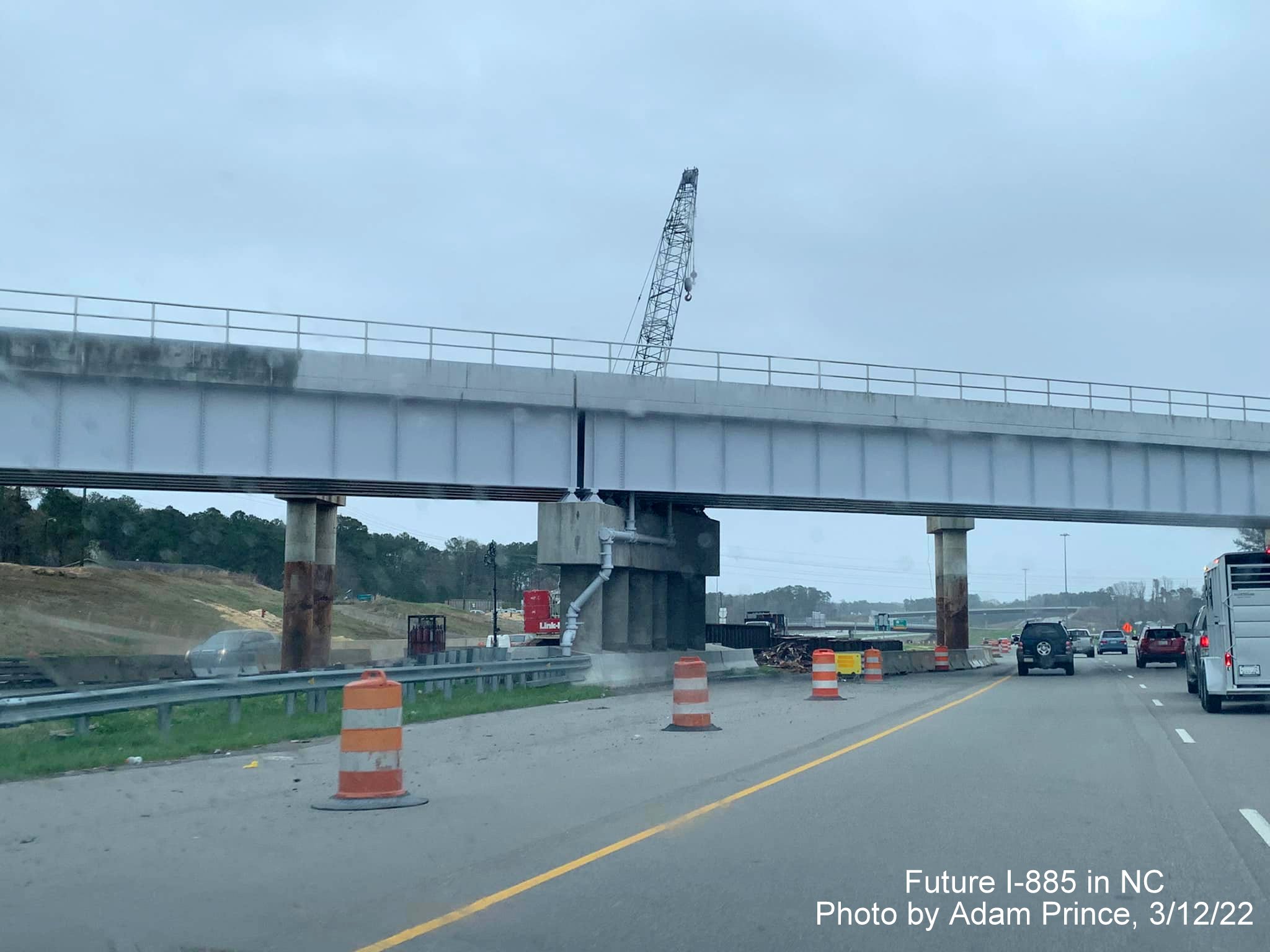 Image of railroad bridge demolition over US 70 (Future I-885) in Durham prior to East End Connector exit, by Adam Prince, March 2022
