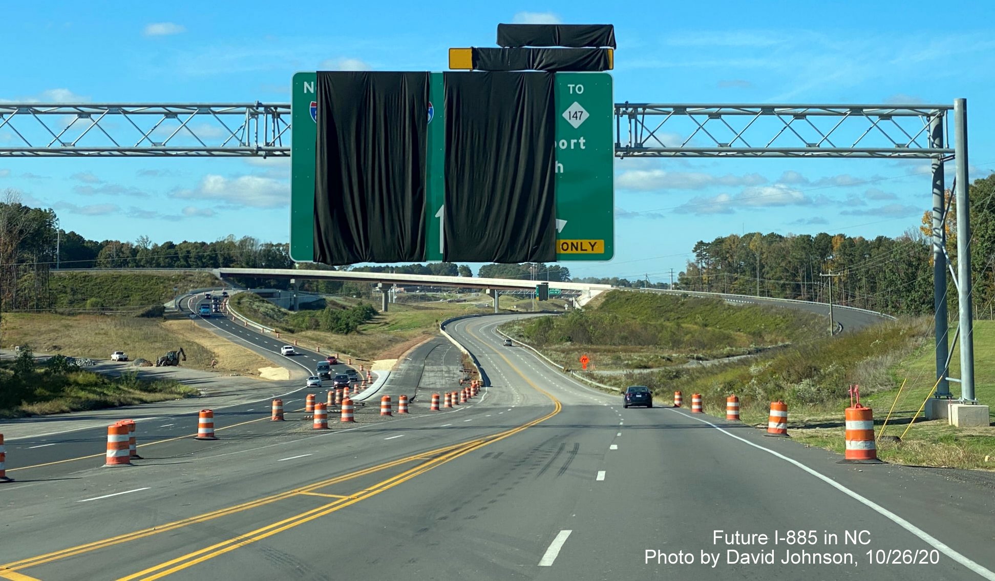 Image of newly placed overhead sign on US 70 West in Durham prior to Future I-885/East End Connector interchange, by David Johnson October 2020