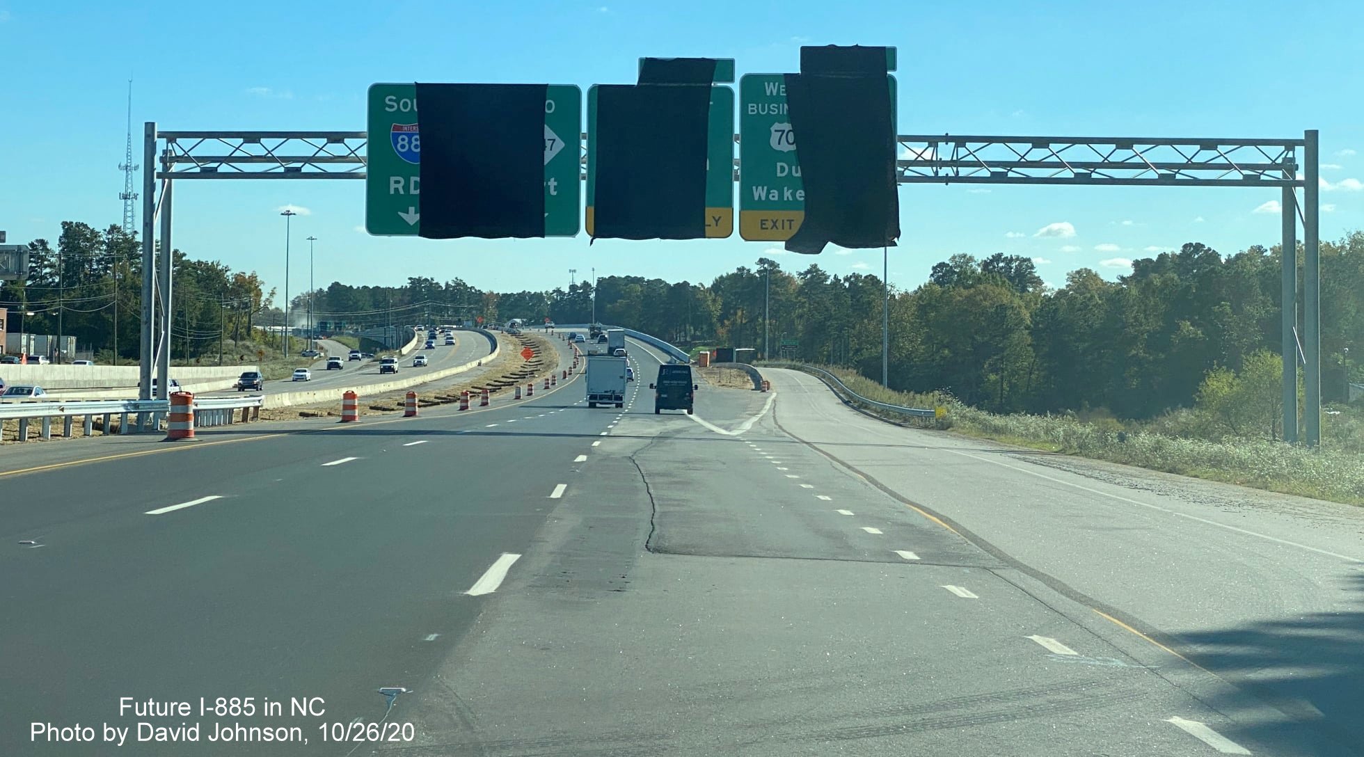 Image of newly placed overhead signs, covered up, on US 70 East (Future I-885 South) at Business 70/NC 98 exit in Durham, photo by David Johnson October 2020