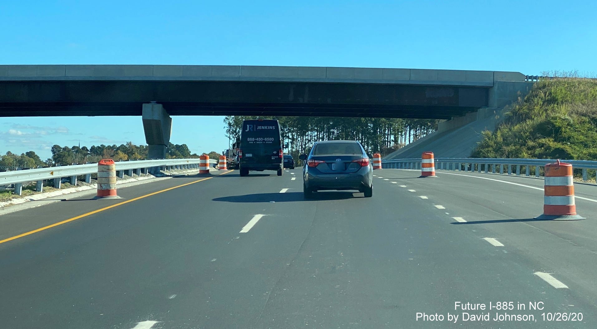 Image of traffic on US 70 East (future exit ramp from I-885 South East End Connector) heading over flyover ramp that will carry US 70 West traffic to Connector in Durham, by David Johnson October 2020