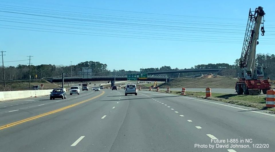 Image of US 70 East traffic using Future I-885 North lanes between railroad bridge and East End Connector interchange under construction in Durham, by David Johnson
