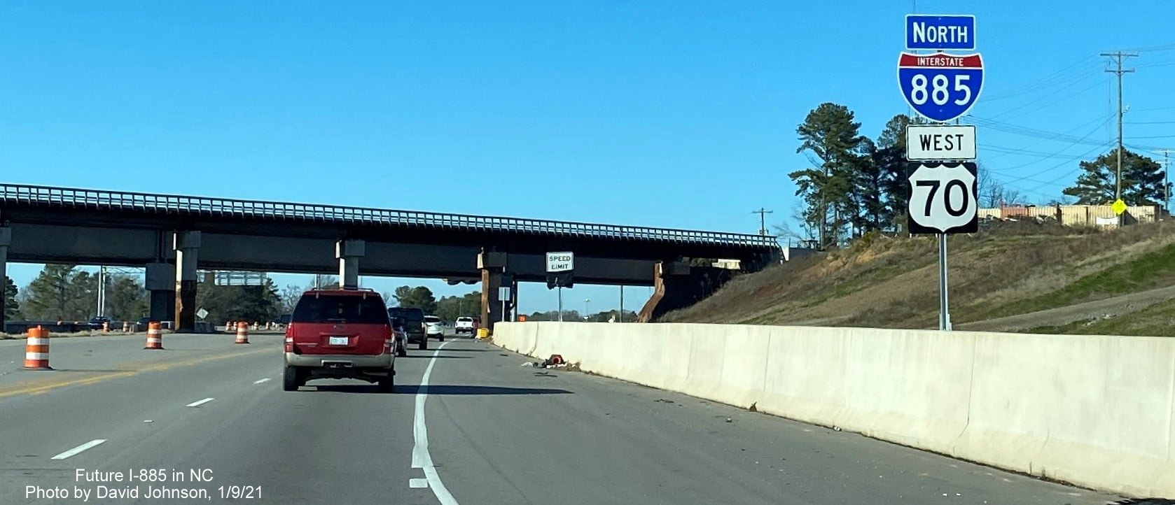 Image of newly placed I-885 North/US 70 West reassurance marker prior to railroad bridge in Durham, by David Johnson, January 2021