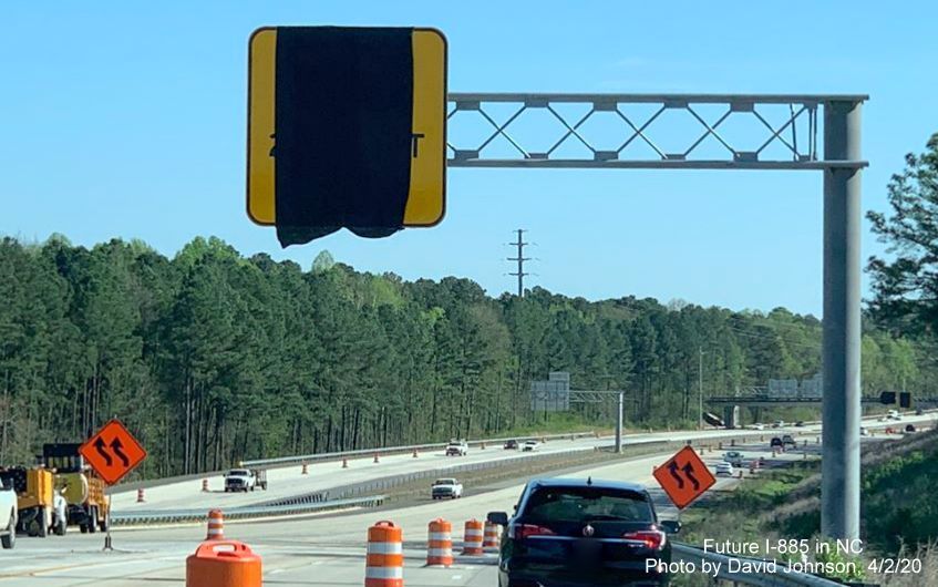Image of covererd over 2 right lanes end overhead advisory sign at ramp with future I-885 South on NC 147 South in Durham, by David Johnson, April 2020
