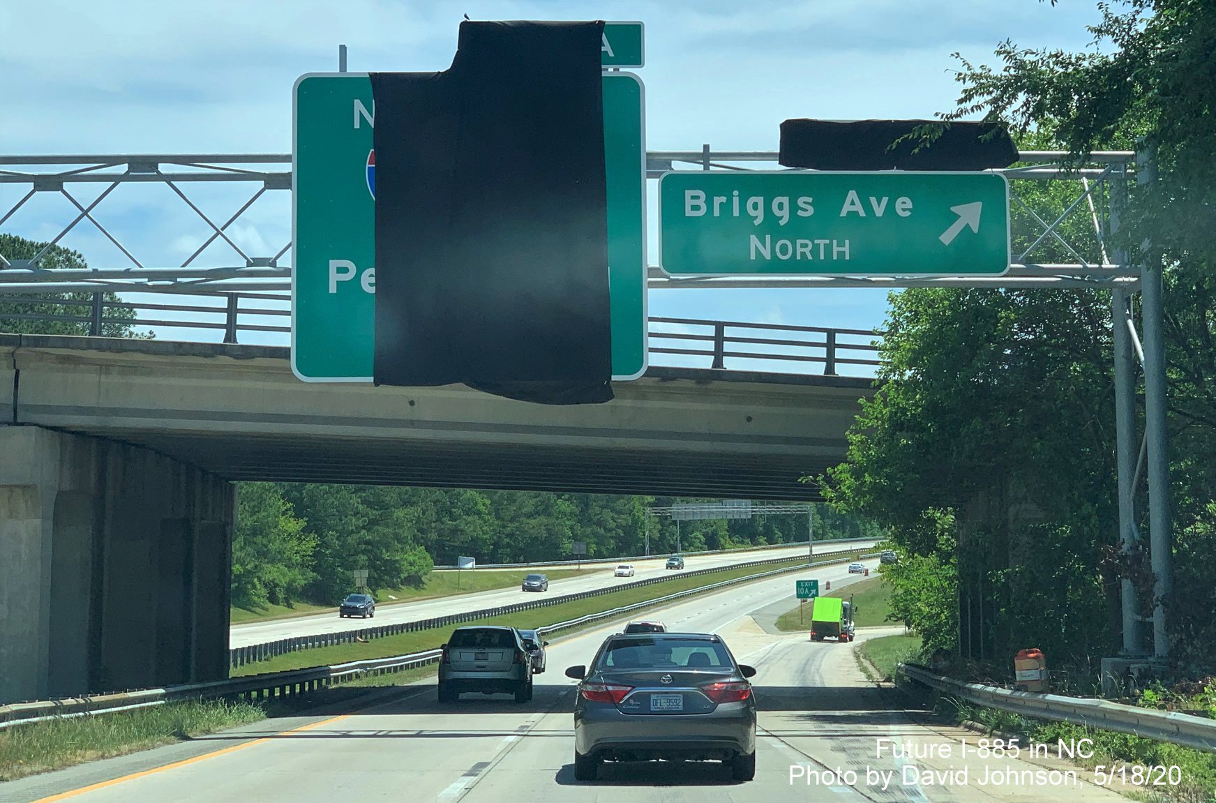Image of newly placed 1/2 mile advance sign for Future I-885 North exit at off-ramp to Briggs Avenue North on NC 147 South in Durham showing new exit number, by David Johnson in May 2020