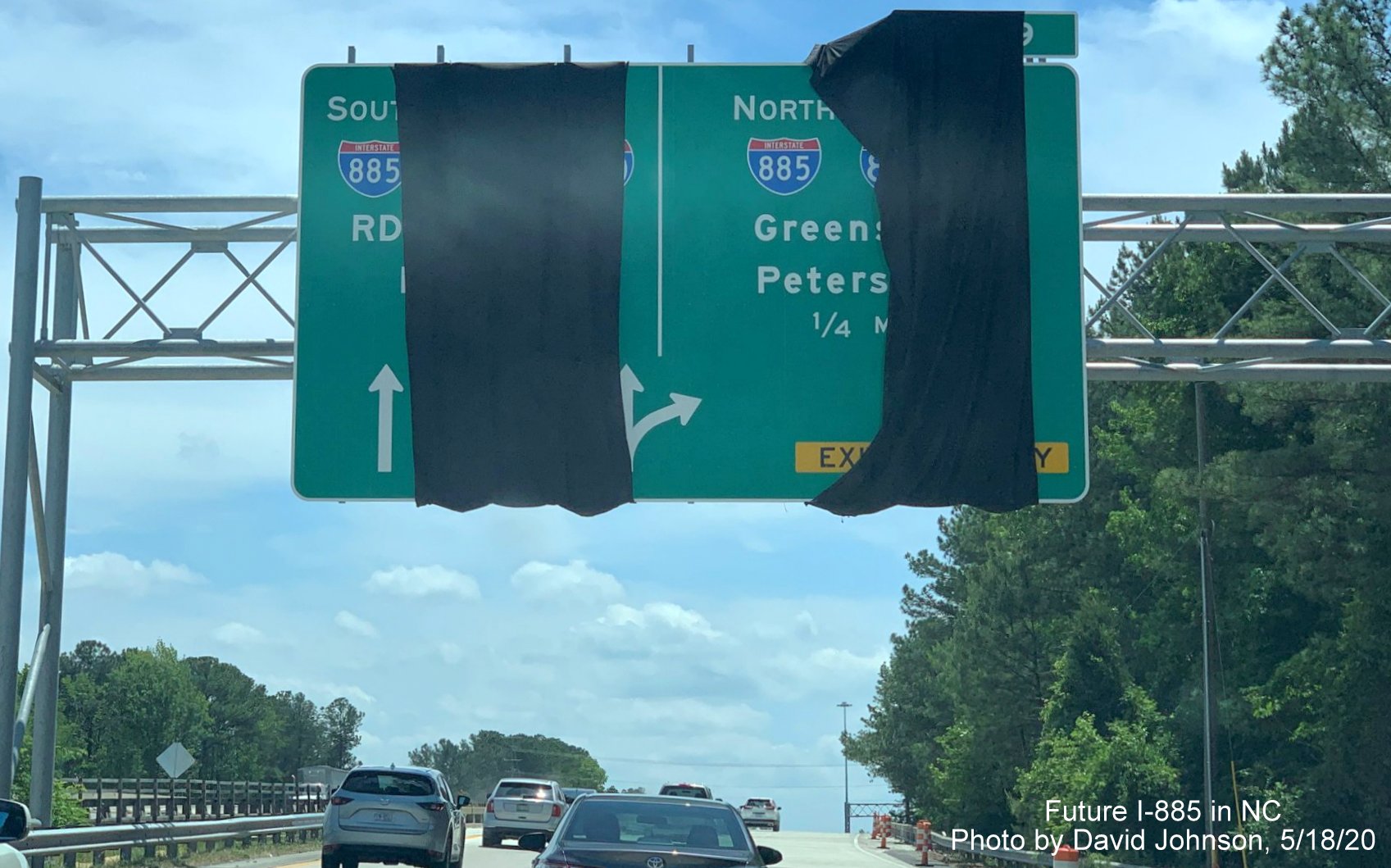 Closeup of overhead 1/4 mile advance sign for future I-885 North exit, with wrong exit number, on NC 147 South in Durham, by David Johnson in May 2020