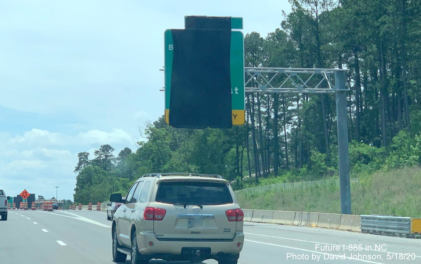 Image of covered up overhead exit ramp sign for future US 70 Business/NC 98 exit on Future I-885 South lanes on US 70 East in Durham, by David Johnson, May 2020