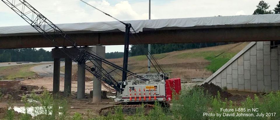Image of construction crane in front of Future I-885 ramp to US 70 East, by David Johnson