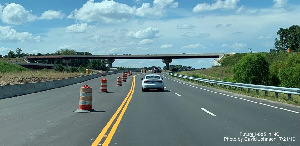 Image of traffic using new US 70 West lanes prior to future flyover ramp to I-885 South in East End Connector Project work zone in Durham, by David Johnson