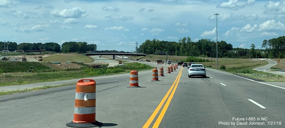 Image of traffic on new US 70 West lanes heading toward Carr Road bridge in East End Connector Project work zone in Durham, by David Johnson 