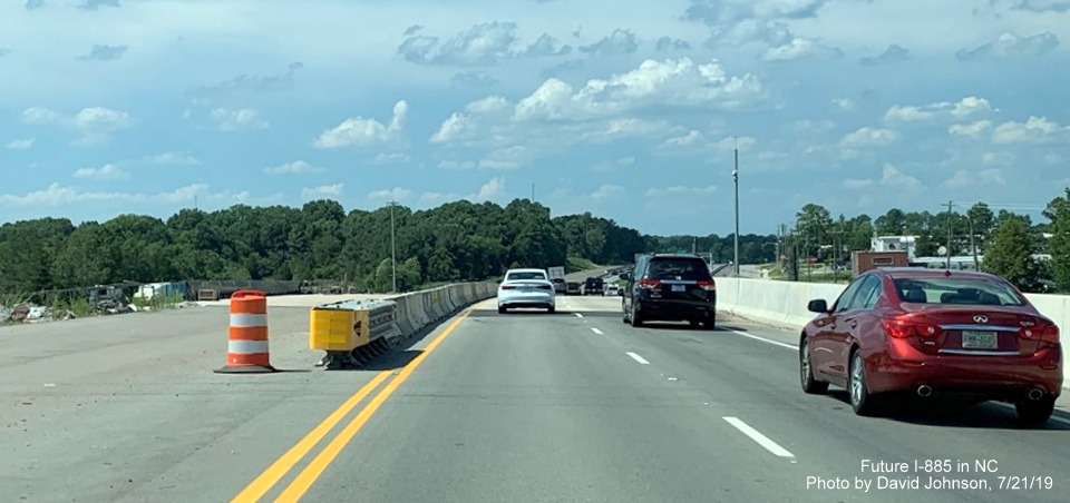 Image of traffic on new US 70 West (Future I-885 North) lanes at NC 98/US 70 Business interchange in East End Connector Project work zone in Durham, by David Johnson