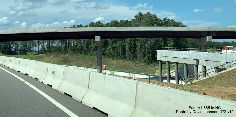 Image of construction for future NC 147 lane tunnel below I-885 South bridge in East End Connector Project work area in Durham, by David Johnson