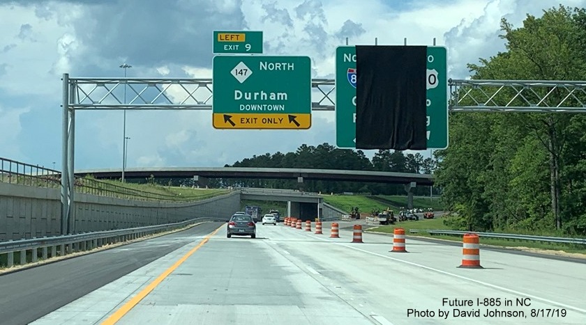 Image of newly placed overhead signage at future split of I-885 and NC 147 North at East End Connector interchange in Durham, by David Johnson