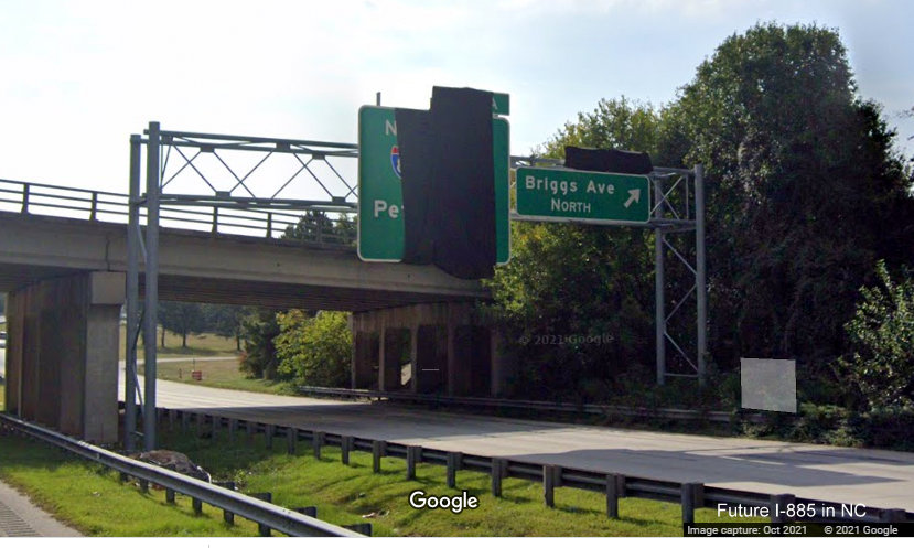 Image of future signage covered over for I-885 North exit with new exit number on NC 147/Durham Freeway South at Briggs Avenue, Google Maps Street View image, October 2021 