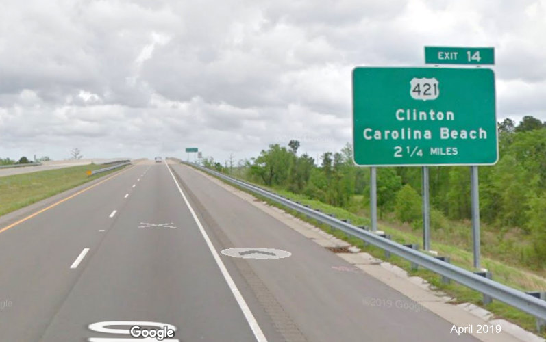 Google Maps Street View image of 2 1/4 miles advance ground mounted sign for US 421 exit on I-140 East, taken in 
                                      April 2019
