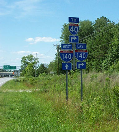 Photo of exit signage for I-140 at interchange with NC 133, July 2006