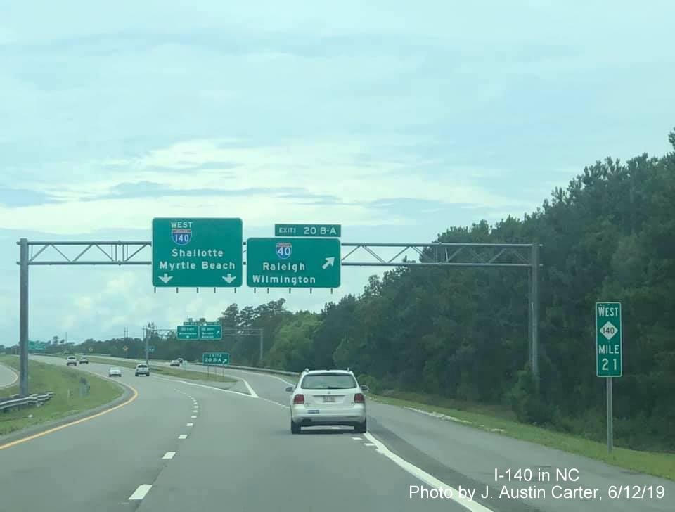 Image of overhead signage along NC 140 West at I-40 showing removed US 17 shield, by J. Austin Carter