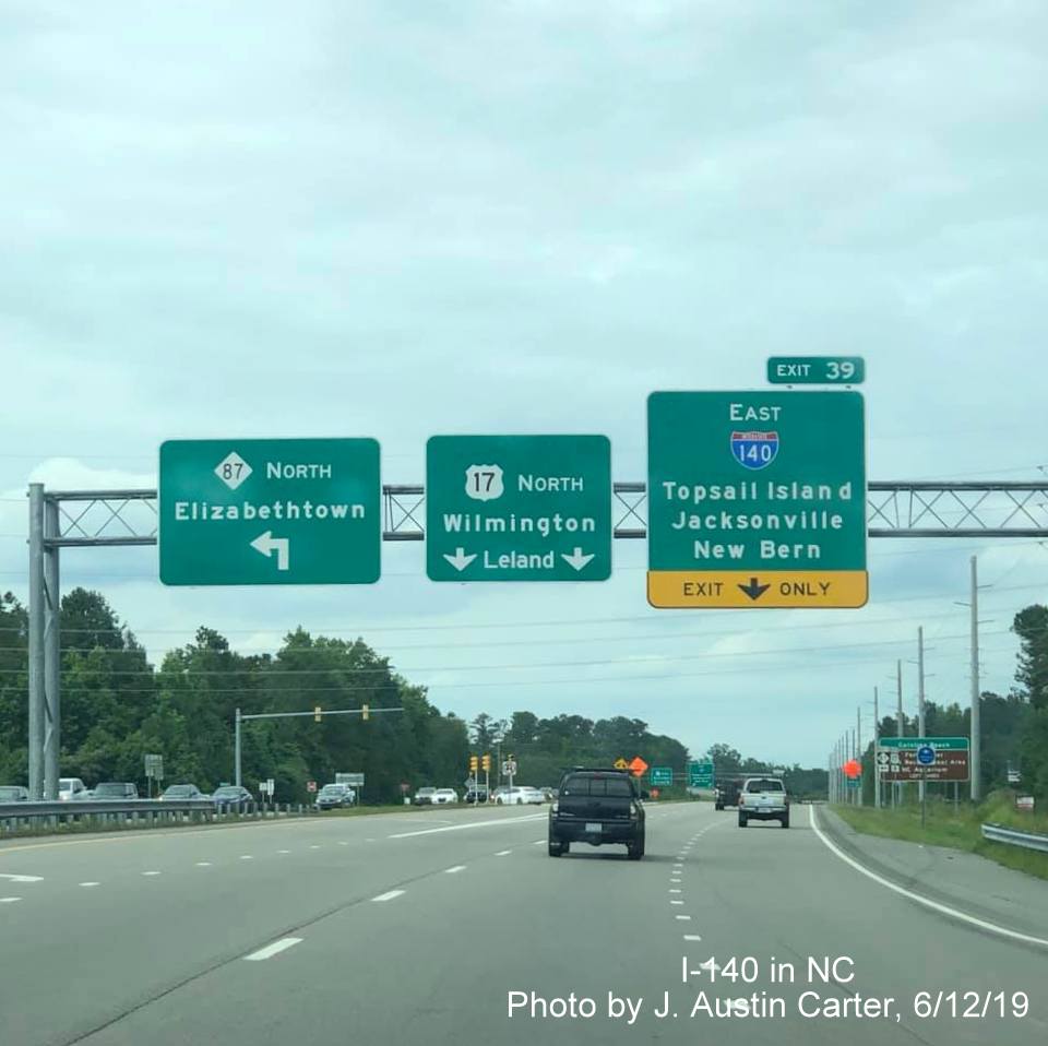 Image of overhead signage for the start of East I-140 south of Wilmington, by J. Austin Carter