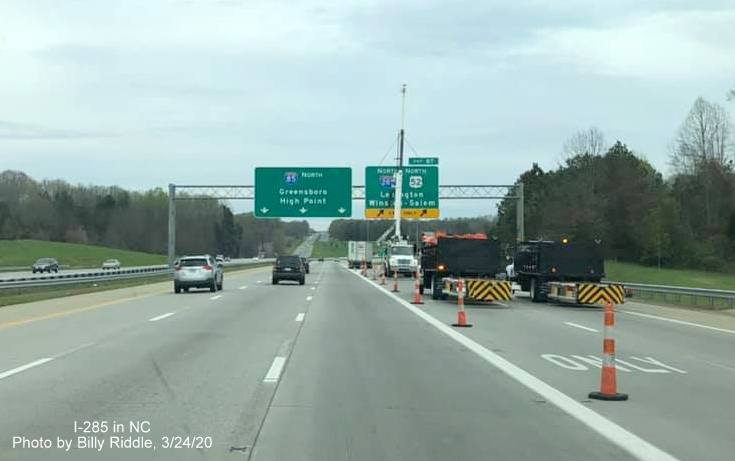 Image of sign contractors placing new overhead ramp sign with I-285 shield at former Business 85 exit on I-85 North in Lexington, by Billy Riddle on March 24, 2020
