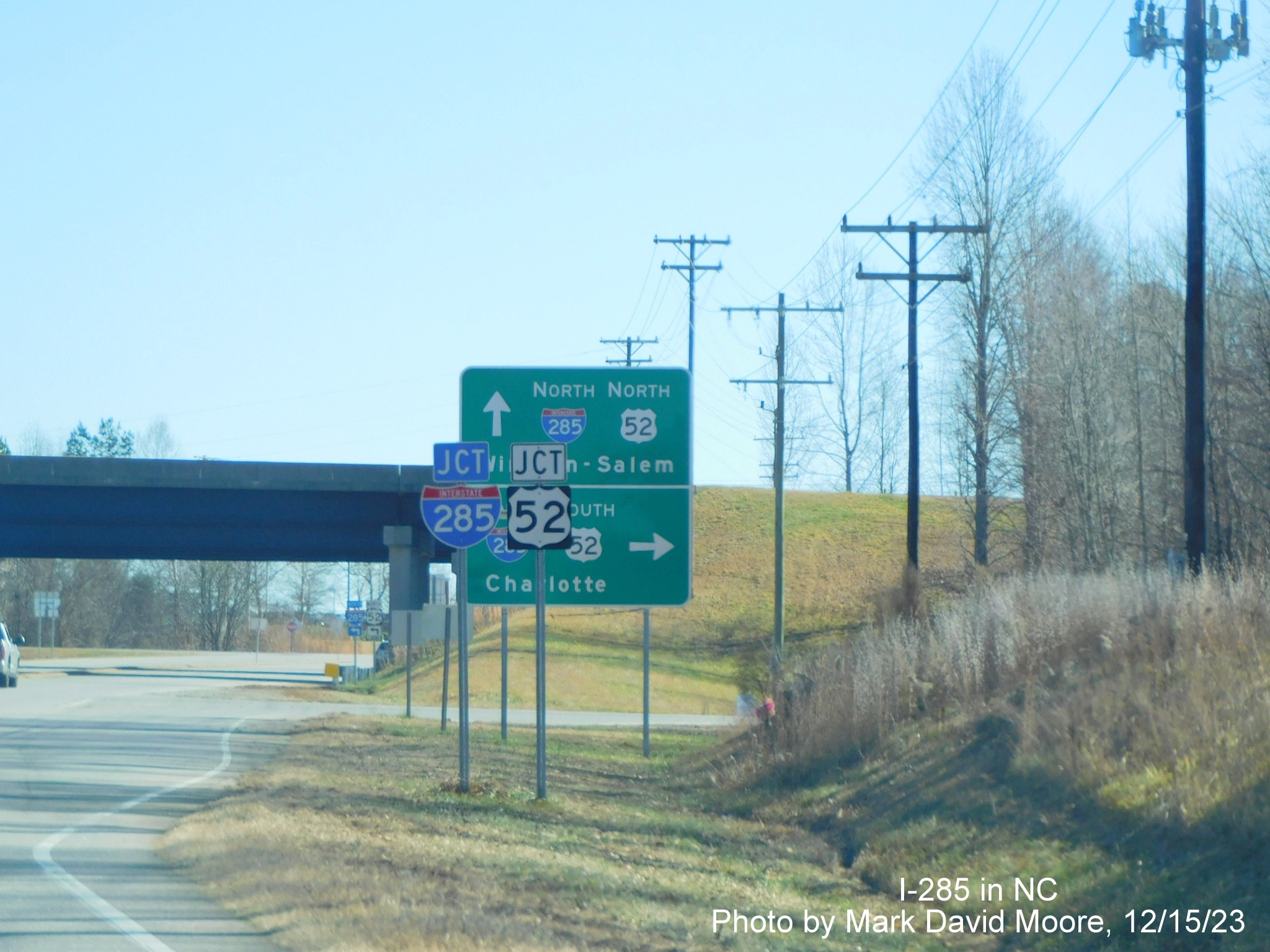 Image of trailblazers and ramp signage for I-285 and US 52 on US 64 East in Lexington, by Mark David Moore, December 2023