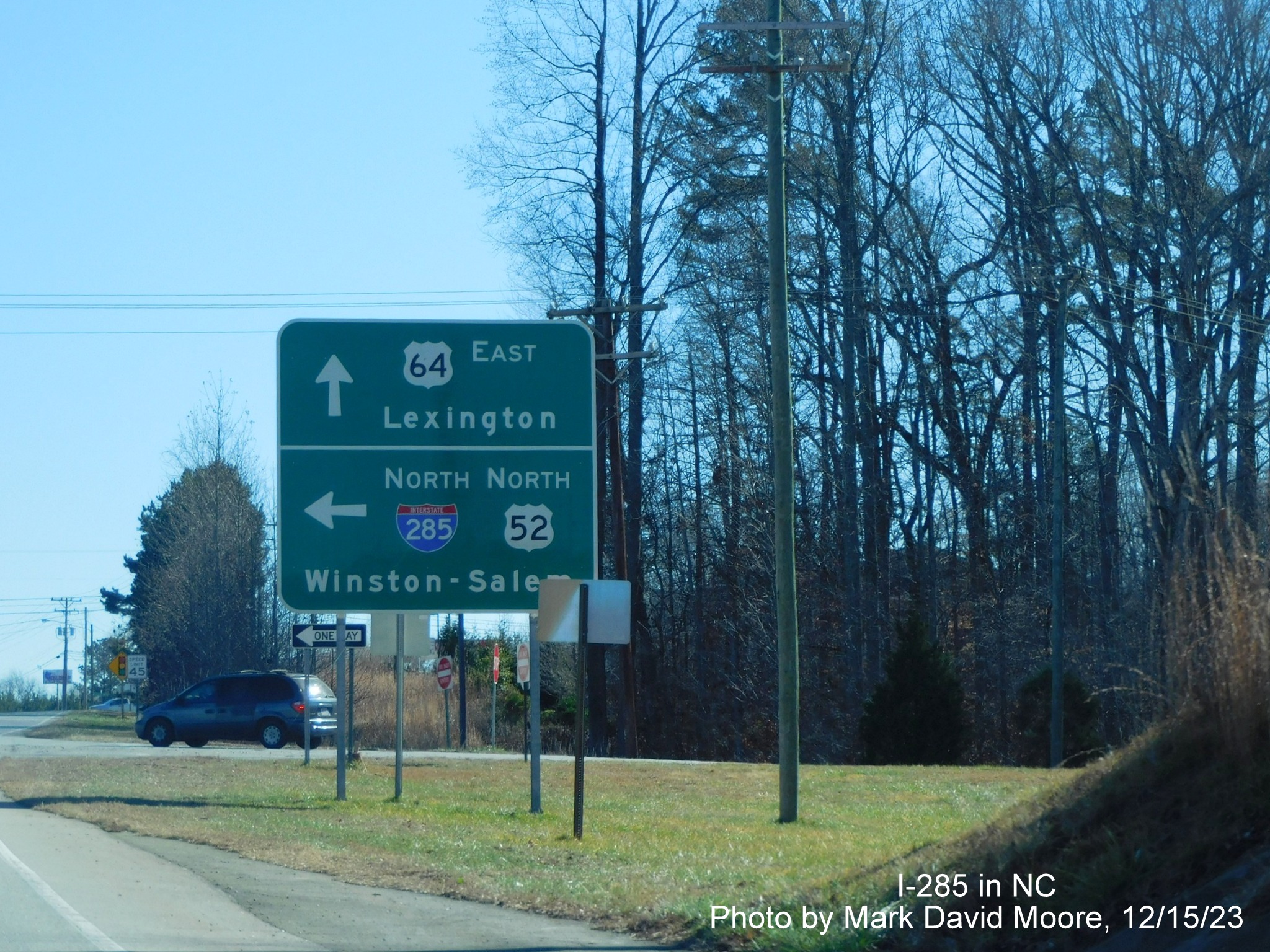 Image of ramp signage for I-285 and US 52 North on US 64 East in Lexington, by Mark David Moore, December 2023