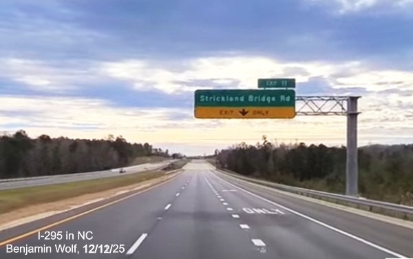 Image of 1/2 Mile Exit Only advance sign for the Strickland Road exit on new section of 
	 I-295 South after the US 401 exit, screen grab from Benjamin Wolf Video, December 2025