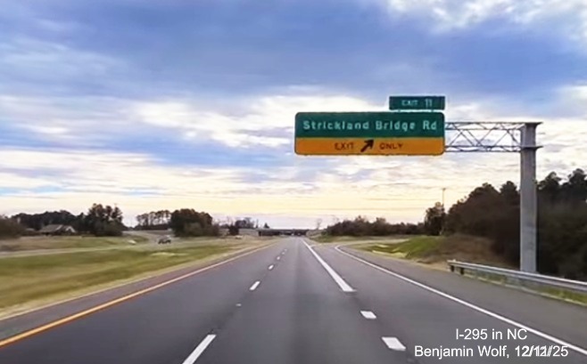Image of overhead ramp sign for Strickland Bridge Road to cross the newly opened section of 
	 I-295 South, screen grab from Benjamin Wolf Video, December 2025