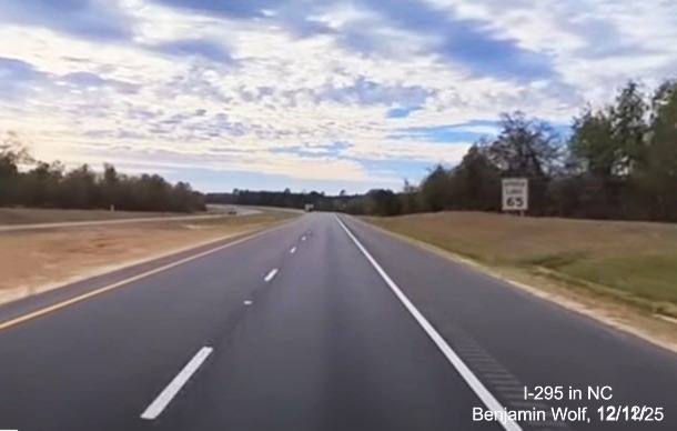 Image of Speed Limit 65 sign after the Strickland Bridge Road exit on newly opened section of 
	 I-295 South, screen grab from Benjamin Wolf Video, December 2025