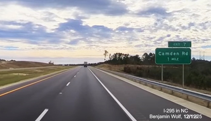 Image of ground mounted 1 mile advance sign for the Camden Road exit on newly opened 
	 section of I-295 South, screen grab from Benjamin Wolf Video, December 2025