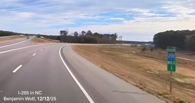 Image of 1 Mile marker just before split of ramps for I-95 at the end of I-295 South, 
	 screen grab from Benjamin Wolf Video, December 2025