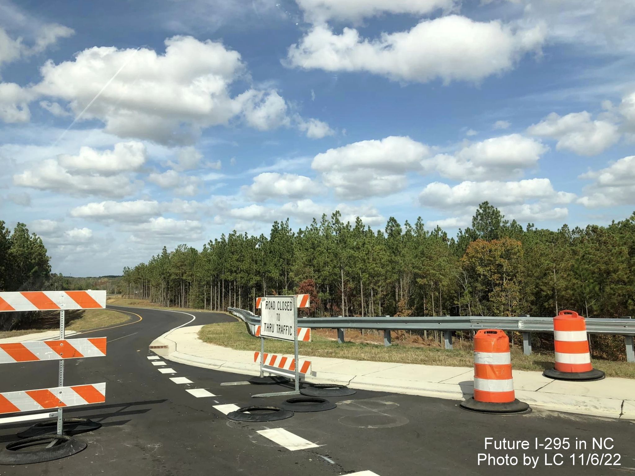 Image taken along new Black Bridge Road roundabout toward closed future ramp to 
        section of Fayetteville Outer Loop, by LC, November 2022