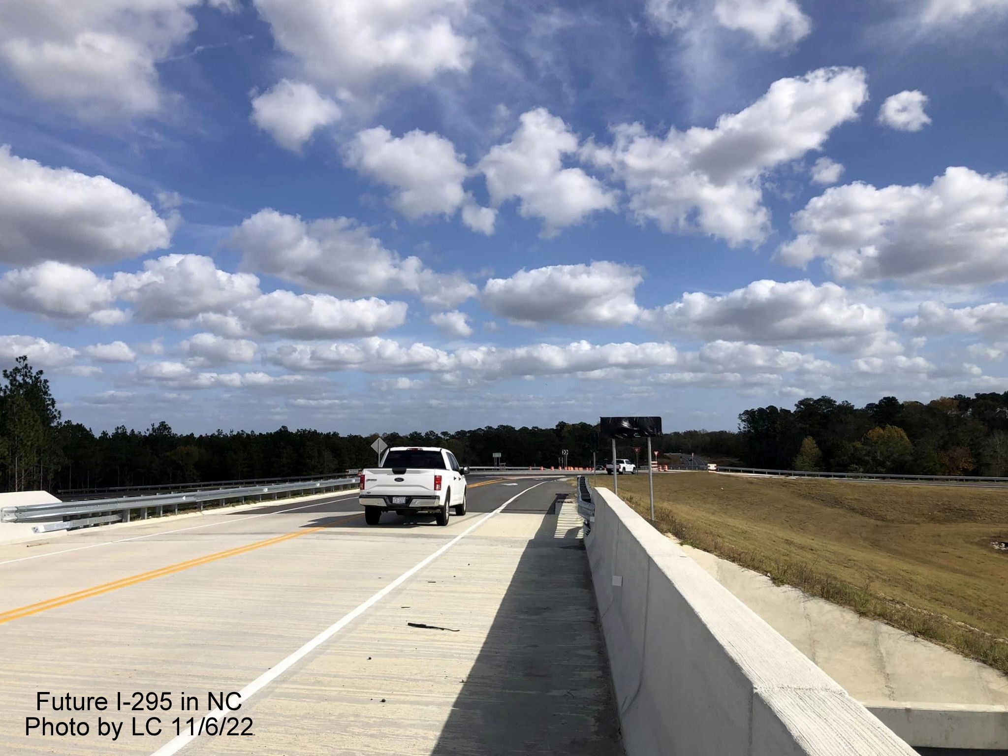 Image taken looking east along Black Bridge Road bridge toward new roundabout with ramps 
        for soon to be opened section of Fayetteville Outer Loop to Parkton/Leeper Roads, by LC, November 2022