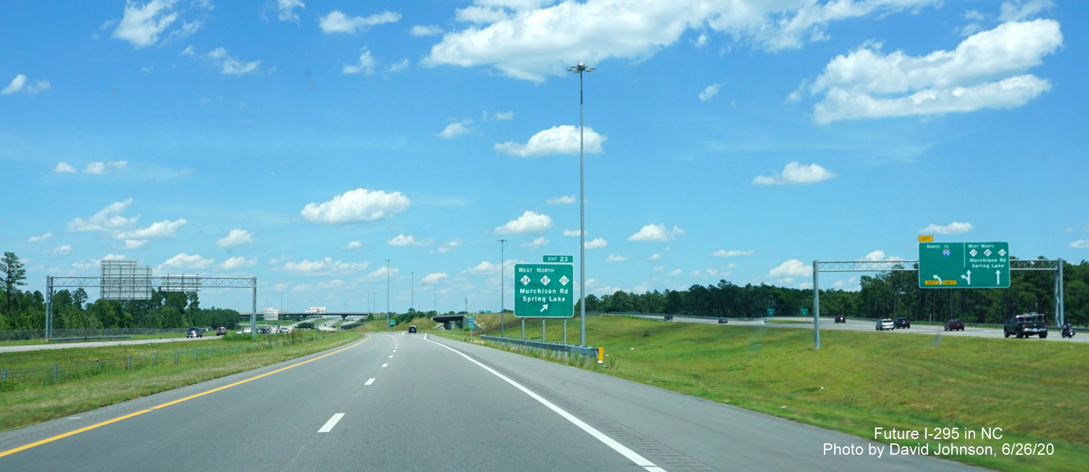 Image of ground mounted signage along I-295 North for the Murchison Road exit and overhead ramp signage
        with a missing 295 shield, by David Johnson June 2020