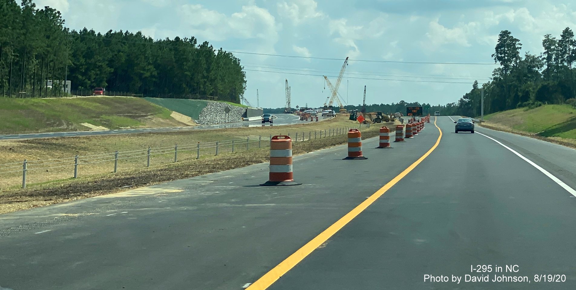 Image of continued Loop construction in median approaching the US 401 exit on Outer Loop/I-295 South in Fayetteville, 
        by David Johnson August 2020