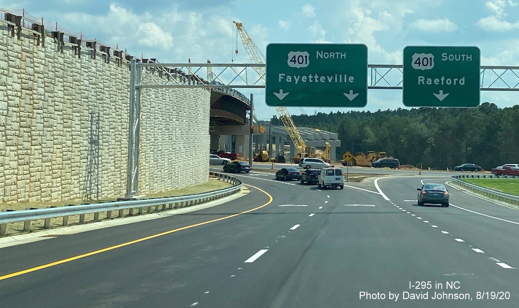 Image of overhead US 401 ramp signs at end of I-295 South in Fayetteville, 
        by David Johnson August 2020