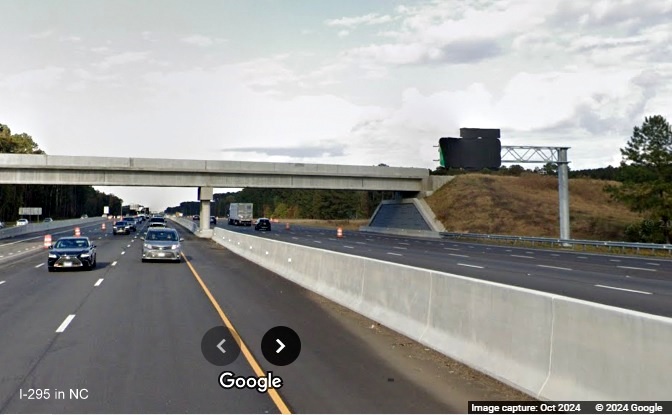 Image of still covered overhead ramp sign for I-295 South exit on I-95 North, Google Maps Street 
        View, October 2024