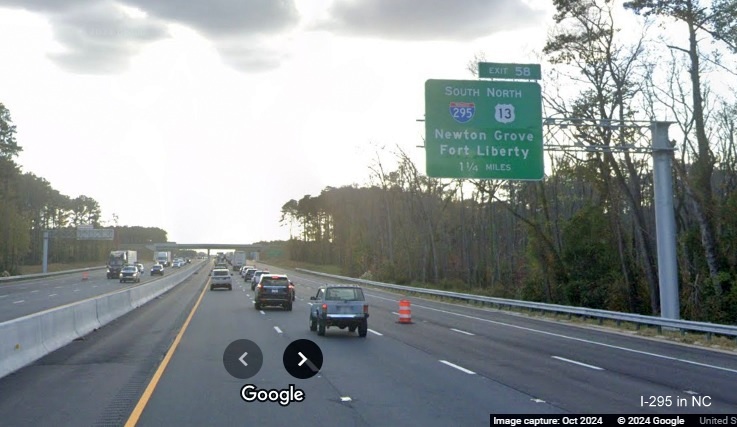 Image of recently placed 1 1/4 Mile advance overhead sign for -295 South/US 13 North exit on 
      I-95 South, Google Maps Street View, October 2024