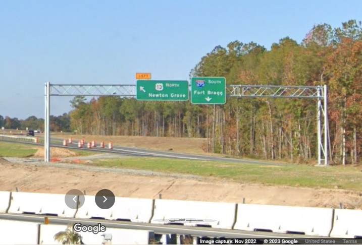 Image of overhead sign for I-295/Fayetteville Outer Loop exit off of I-95 South in Wade, Google 
        Maps Street View, November 2022