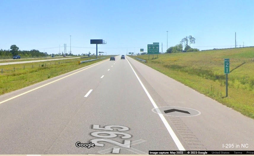 Image of mile marker no longer with I-295 shield at the NC 24/27 Bragg Blvd. interchange, Fayetteville Outer Loop, Google Maps Street View, 
        May 2022